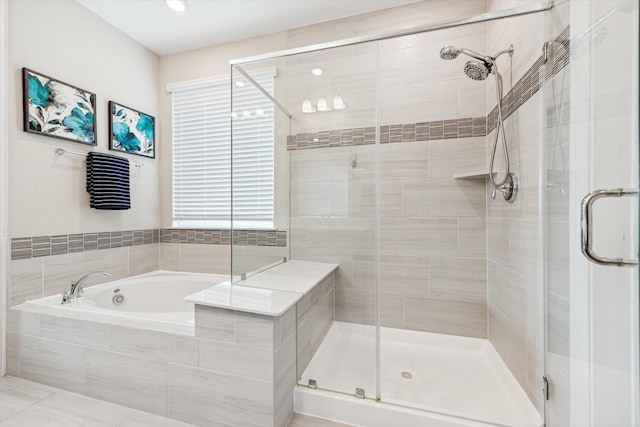 bathroom featuring independent shower and bath