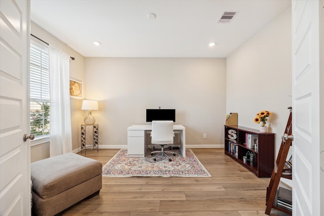 office space with light wood-type flooring