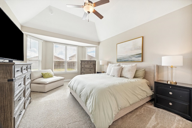 bedroom featuring lofted ceiling, light carpet, and ceiling fan