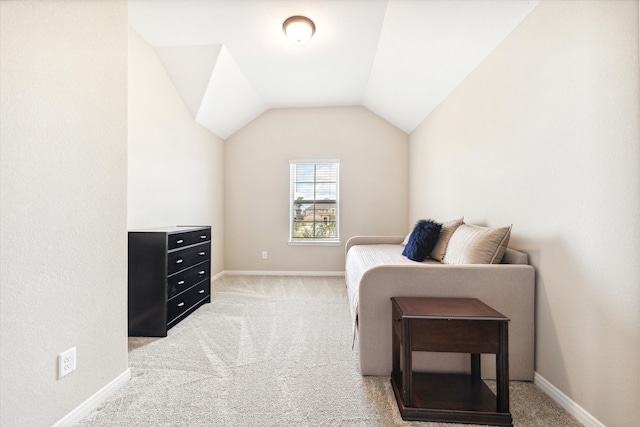 bedroom featuring light carpet and lofted ceiling