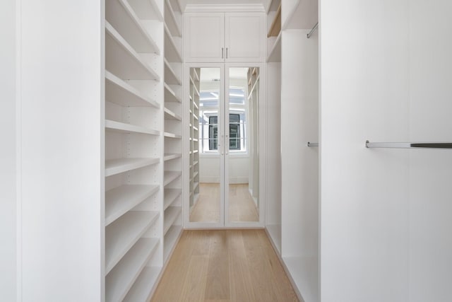 walk in closet featuring light hardwood / wood-style floors