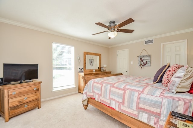 carpeted bedroom featuring crown molding and ceiling fan