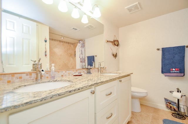 bathroom featuring vanity, tile patterned flooring, toilet, and a shower with shower curtain