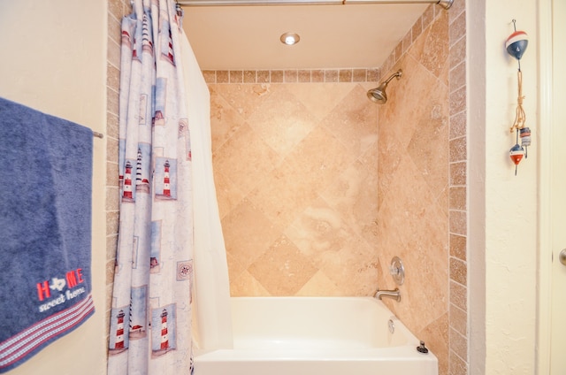 bathroom with shower / tub combo with curtain