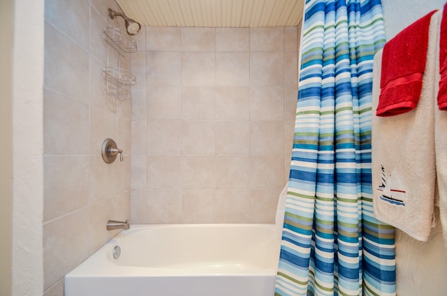 bathroom featuring shower / tub combo with curtain