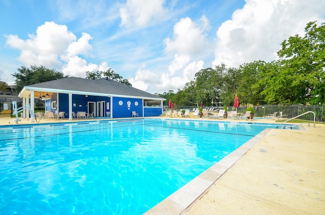 view of swimming pool with a patio area