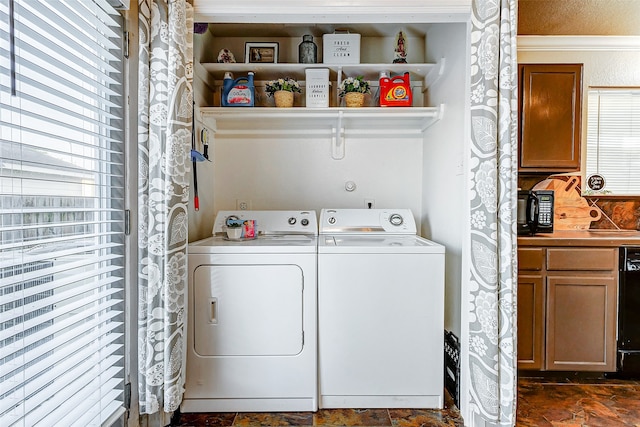 laundry room with separate washer and dryer and a wealth of natural light