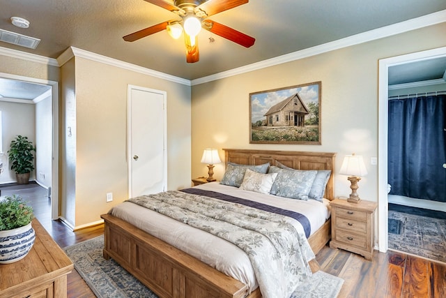 bedroom featuring crown molding, ceiling fan, a closet, and dark hardwood / wood-style flooring