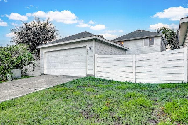 garage featuring a yard