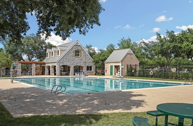 view of swimming pool featuring a patio