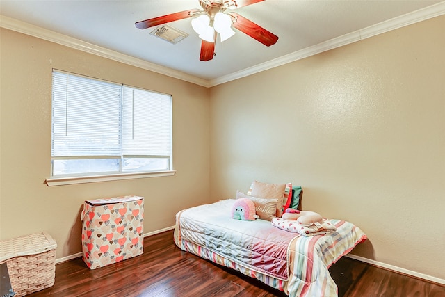 bedroom featuring ceiling fan, crown molding, and dark wood-type flooring