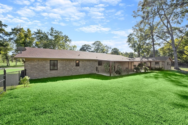 back of house with a yard