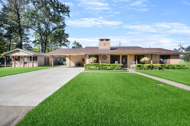 ranch-style house featuring a carport and a front yard