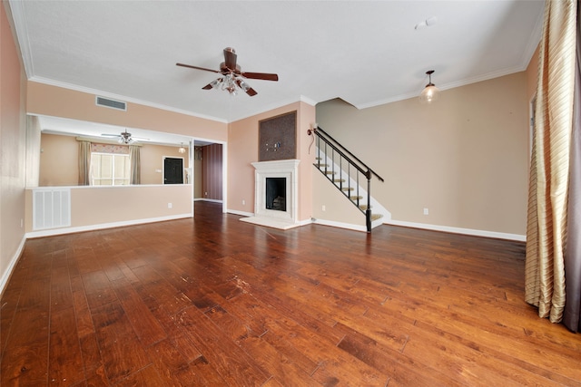 unfurnished living room with ceiling fan, crown molding, and hardwood / wood-style floors