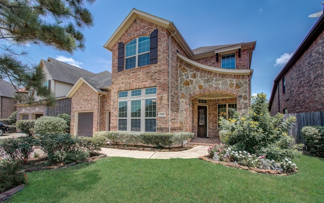 front facade with a garage and a front lawn