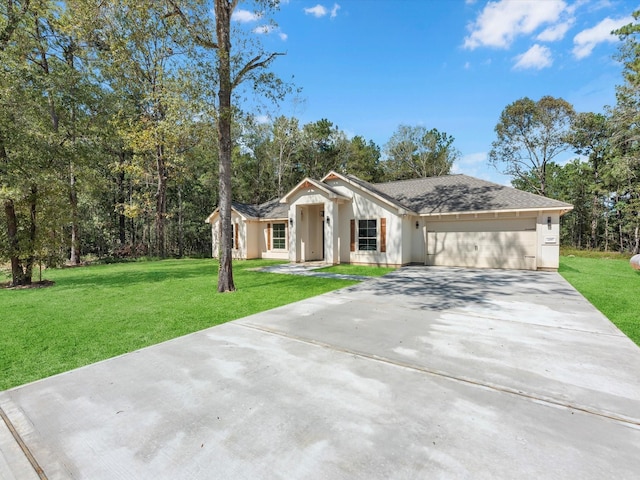 single story home with a garage and a front lawn