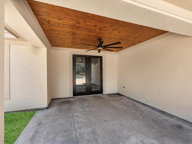 property entrance featuring french doors, ceiling fan, and a patio