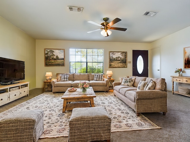 carpeted living room featuring ceiling fan