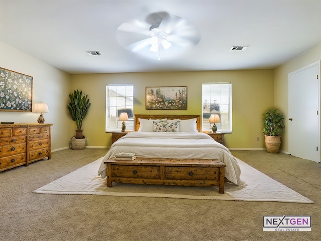 bedroom featuring ceiling fan and light colored carpet