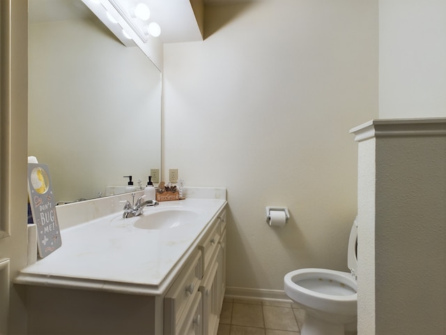 bathroom with vanity, toilet, and tile patterned flooring