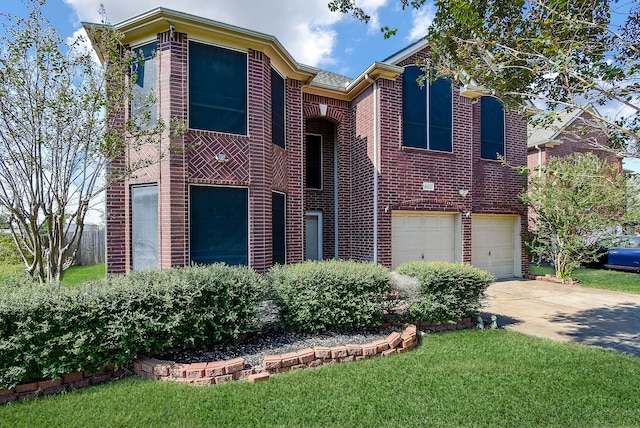 view of front of house featuring a garage and a front yard