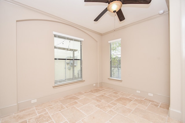 unfurnished room with ceiling fan and ornamental molding