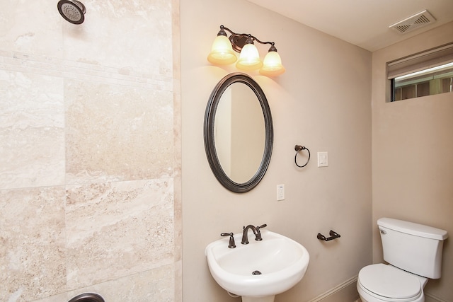 bathroom with toilet and sink