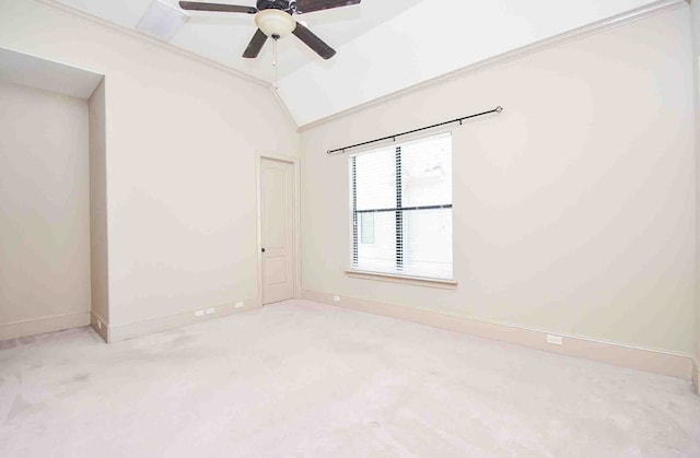 unfurnished room with ceiling fan, carpet floors, and vaulted ceiling