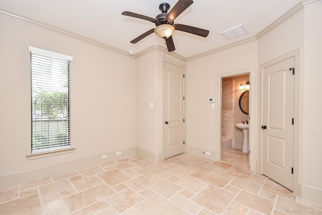 empty room featuring ceiling fan and ornamental molding