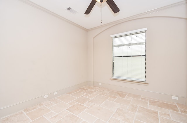 empty room featuring ceiling fan and ornamental molding