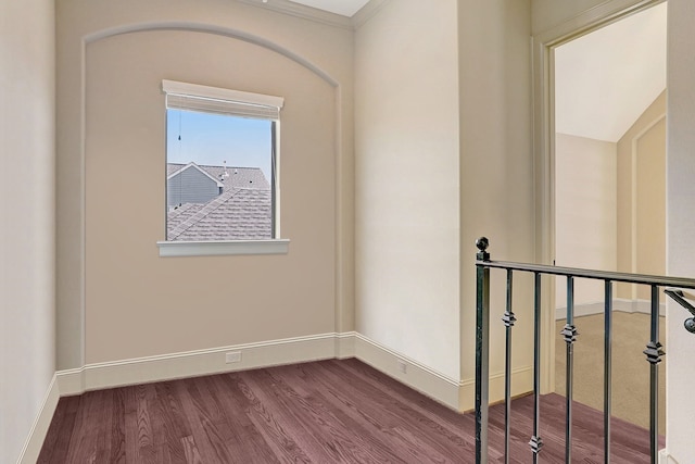 interior space with hardwood / wood-style flooring and ornamental molding