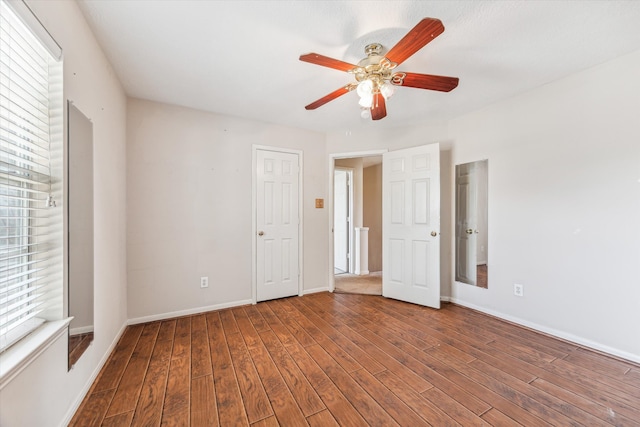 unfurnished room with ceiling fan and hardwood / wood-style floors