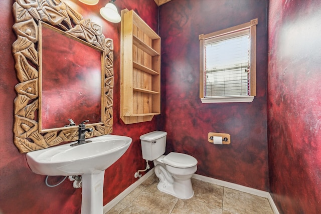 bathroom featuring tile patterned flooring and toilet