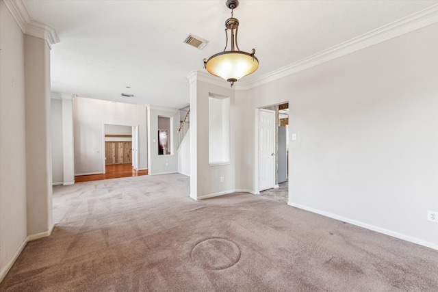 unfurnished room featuring crown molding and light colored carpet