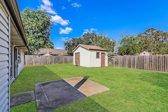 view of yard with a shed and a patio