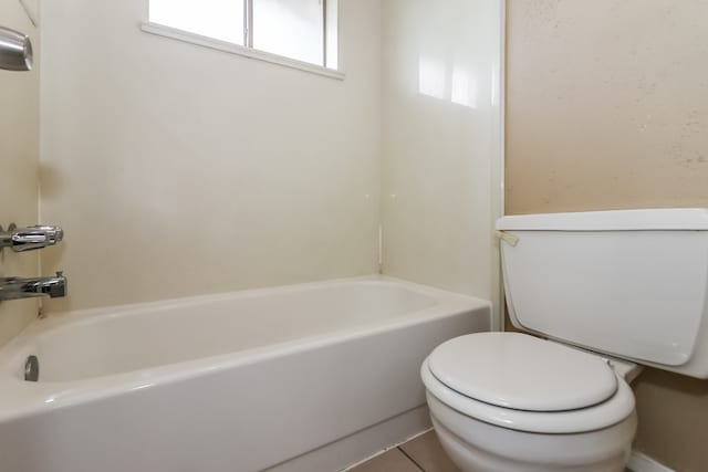 bathroom featuring tile patterned flooring and toilet