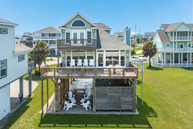 back of house with a patio area, a yard, and a wooden deck