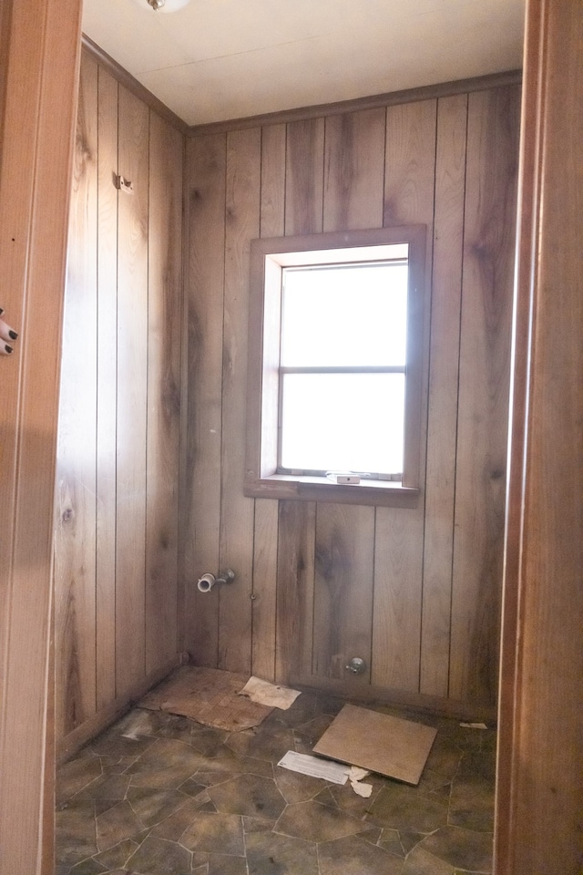 empty room featuring wooden walls