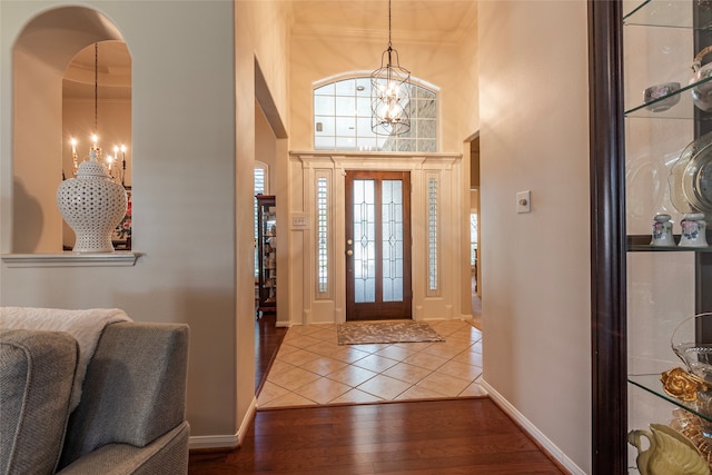 entrance foyer with a chandelier and hardwood / wood-style floors