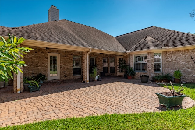 back of property with a patio area