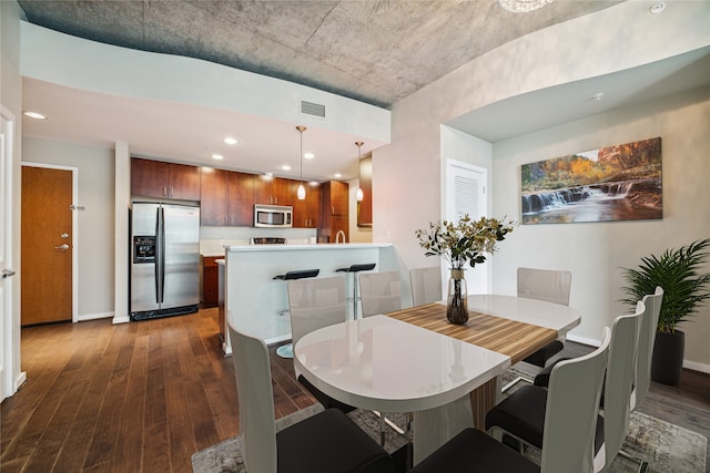 dining area featuring dark hardwood / wood-style floors