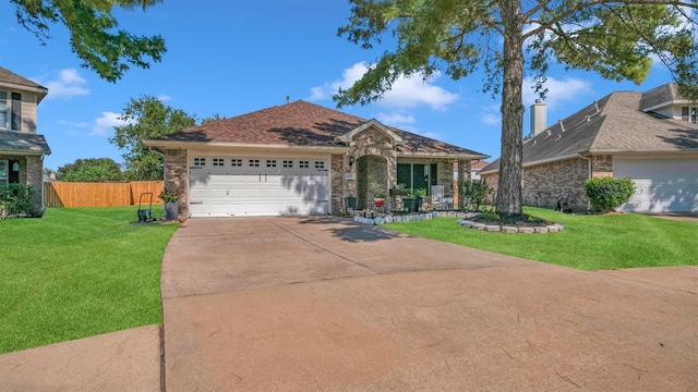 ranch-style home with a front lawn and a garage