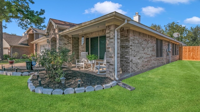 view of home's exterior with a patio and a lawn