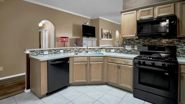 kitchen with sink, light tile patterned floors, backsplash, black appliances, and crown molding