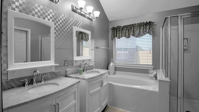 bathroom featuring vanity, plus walk in shower, and lofted ceiling