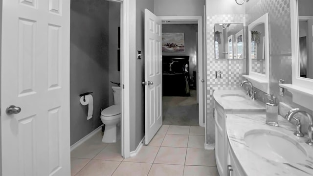 bathroom featuring tile patterned flooring, vanity, and toilet