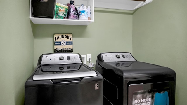 clothes washing area featuring washing machine and clothes dryer