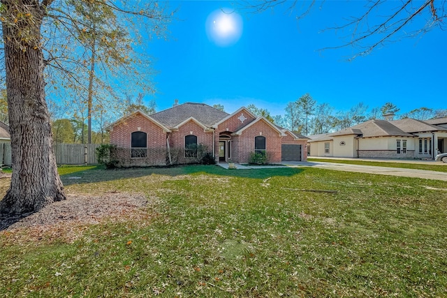 single story home featuring a front lawn and a garage