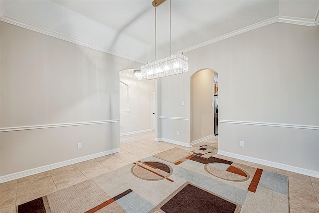 unfurnished dining area with light tile patterned floors, an inviting chandelier, and ornamental molding