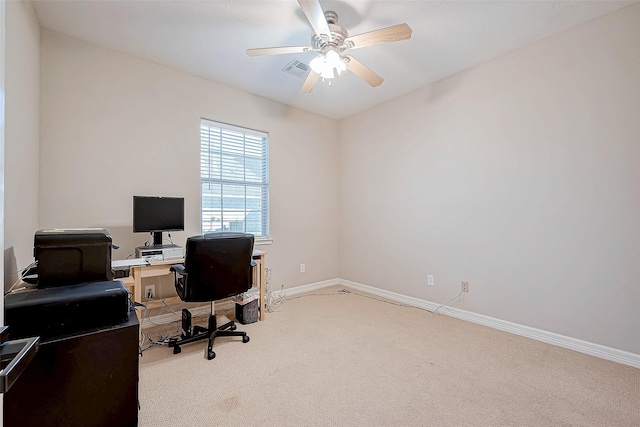 carpeted office with ceiling fan